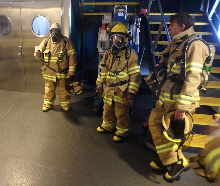 Several members of fire team in full gear.
