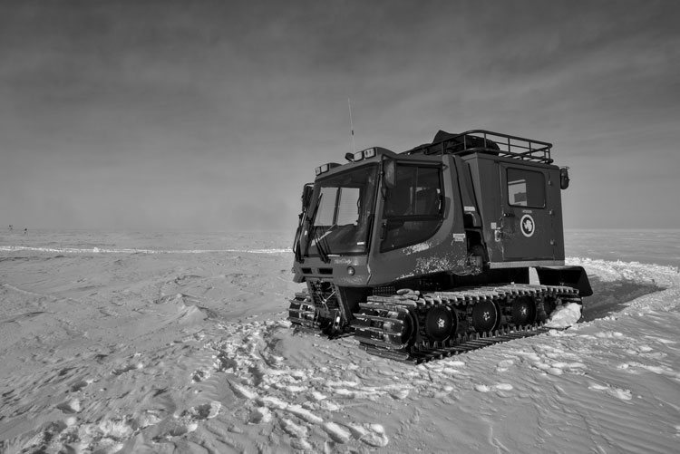 Black and white photo of a pistenbully (a snow vehicle)