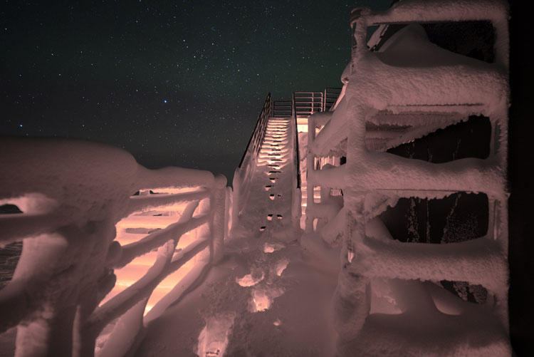 Staircase covered with thick layer of snow