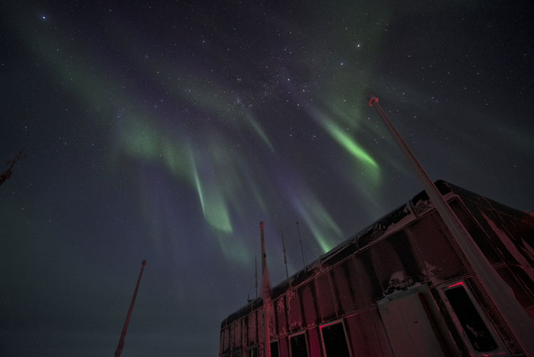 Looking up at auroras from observation deck at South Pole station