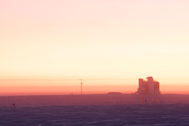 Pink sky on horizon at South Pole sunrise