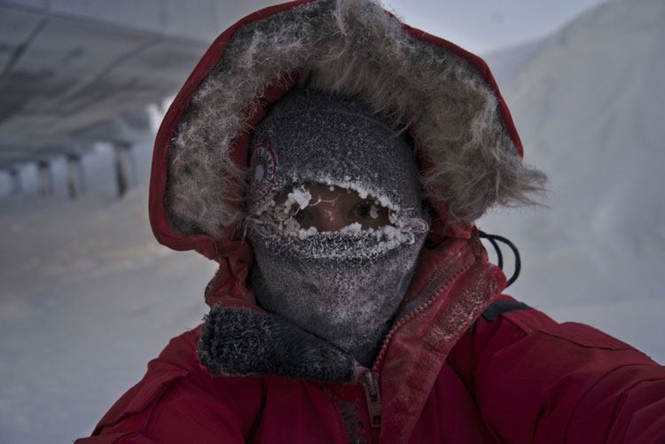 Close-up of face behind facemask, all frosted