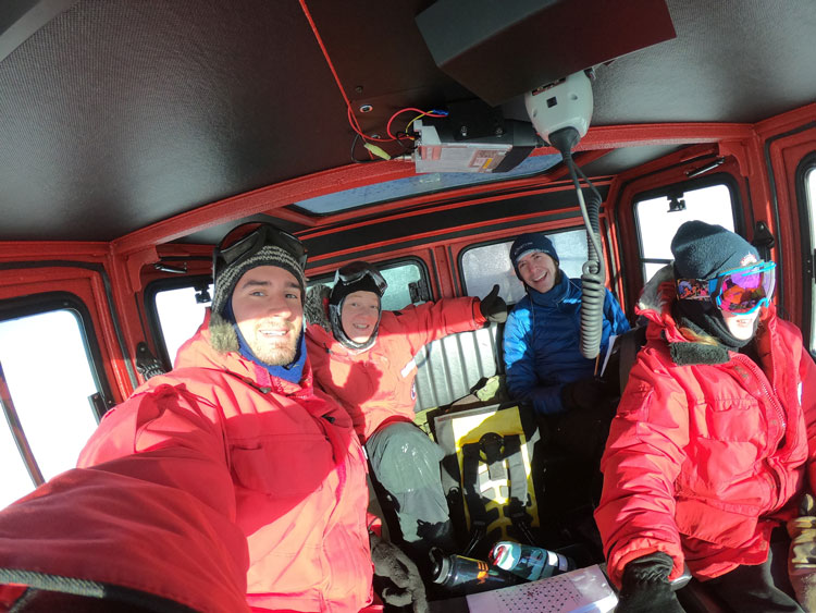 Selfie of 4 people inside snowcat