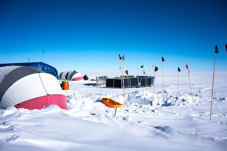 Various tents set up on the snow