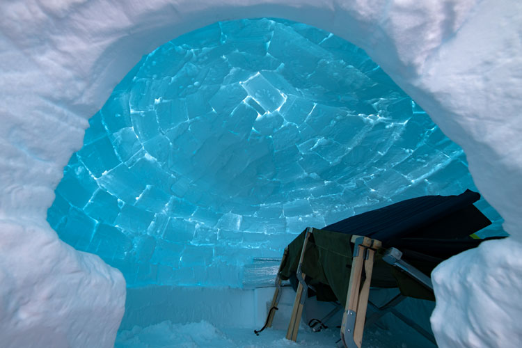 inside view of igloo, with cots