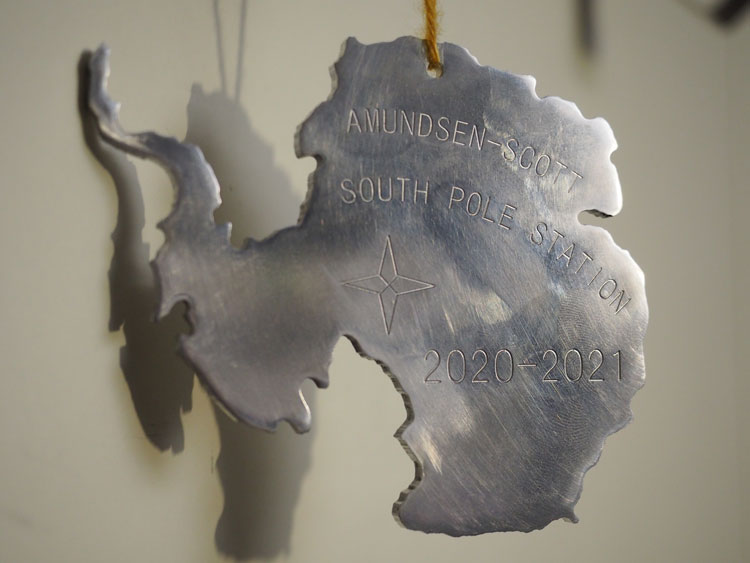 Close-up of Antarctica-shaped metal ornament