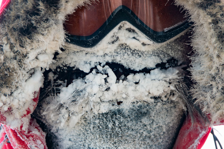 Close up of face wearing goggles and very frosted