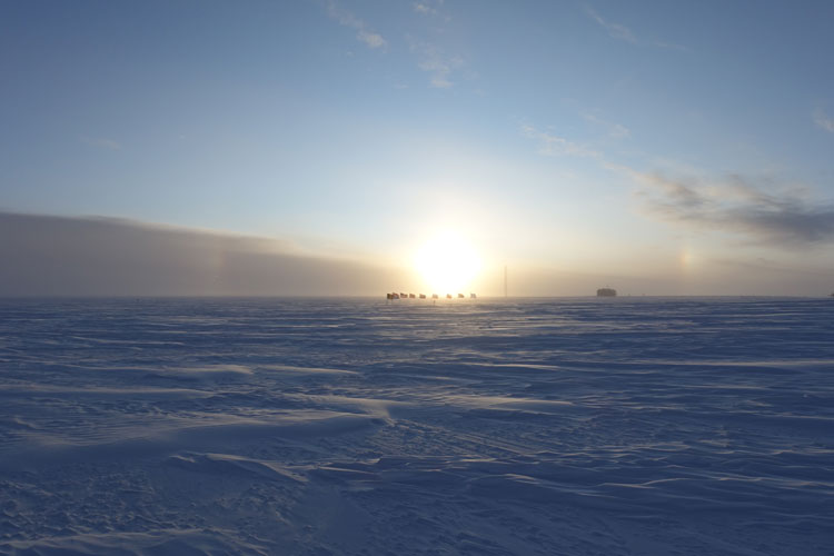 Low sun, partly cloudy sky, at south pole