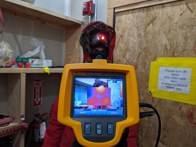 Thermal imaging device held up to a person