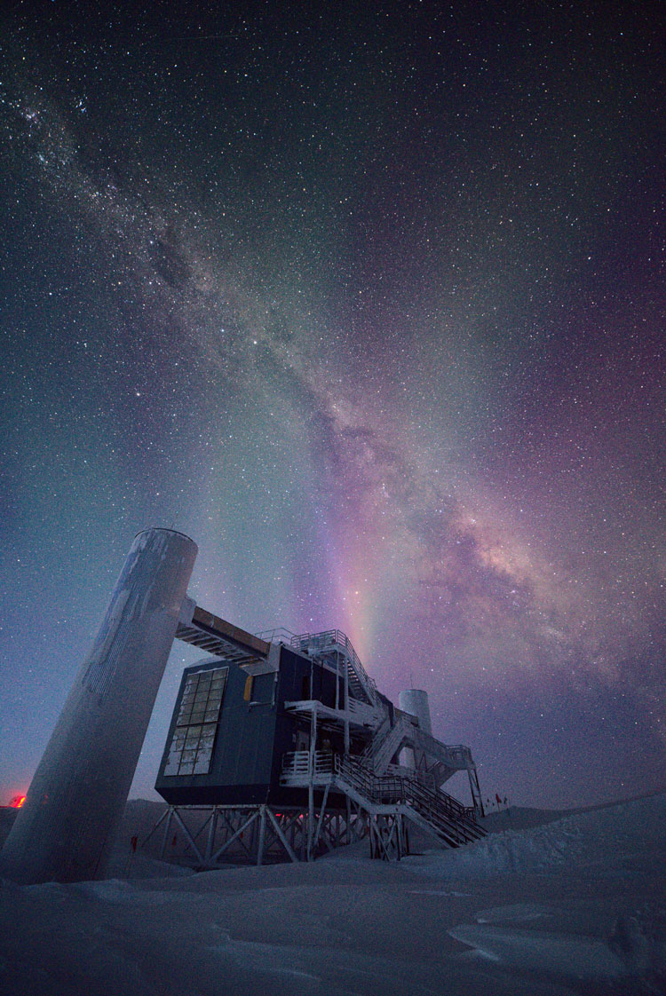 Vertical image of IceCube Lab with Milky Way and auroras above
