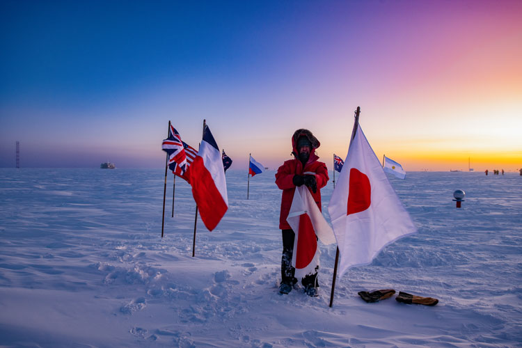 Someone holding tattered flag of Japan