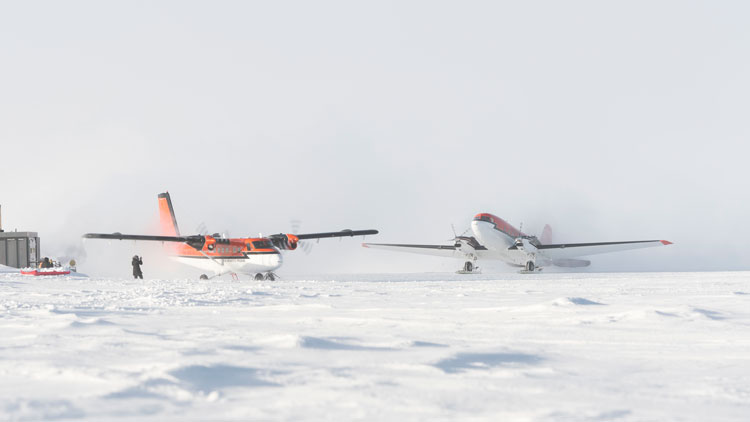 Two planes on the ground at the same time at the South Pole.