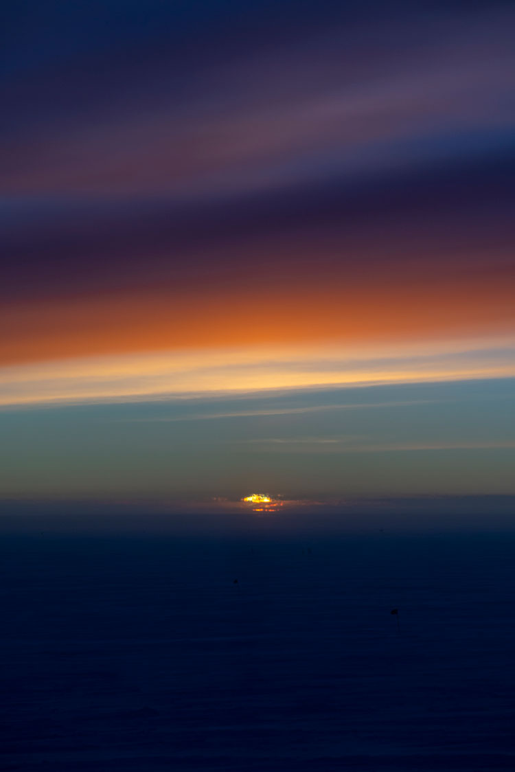 Strong dark colors in sky at sunset at the South Pole.