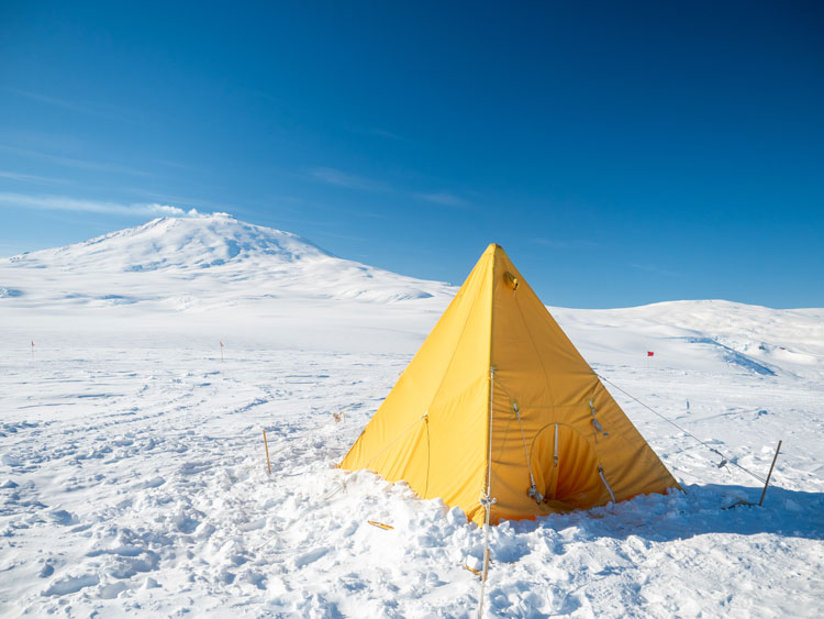 A Scott tent pitched on icy plateau.
