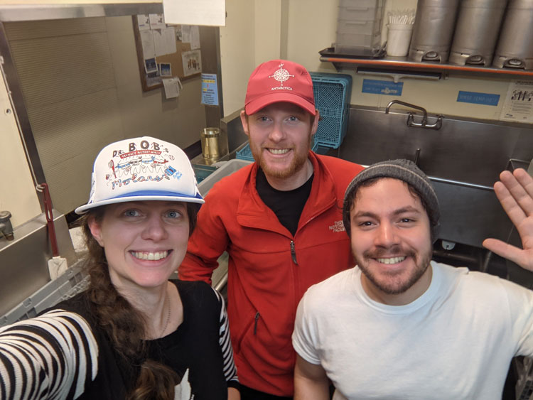 Group of three selfie in the kitchen’s dishpit.