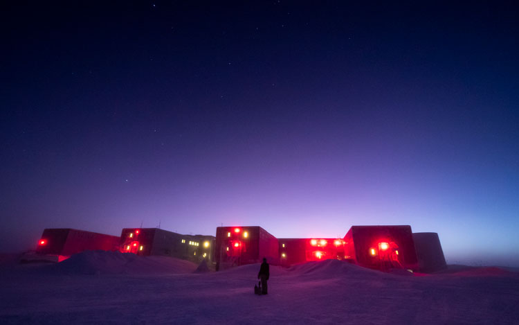 South Pole station with brightening sky at twilight.