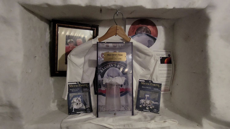One of the shrines in the ice tunnels below the South Pole station, with memorabilia from Buzz Aldrin’s trip there.