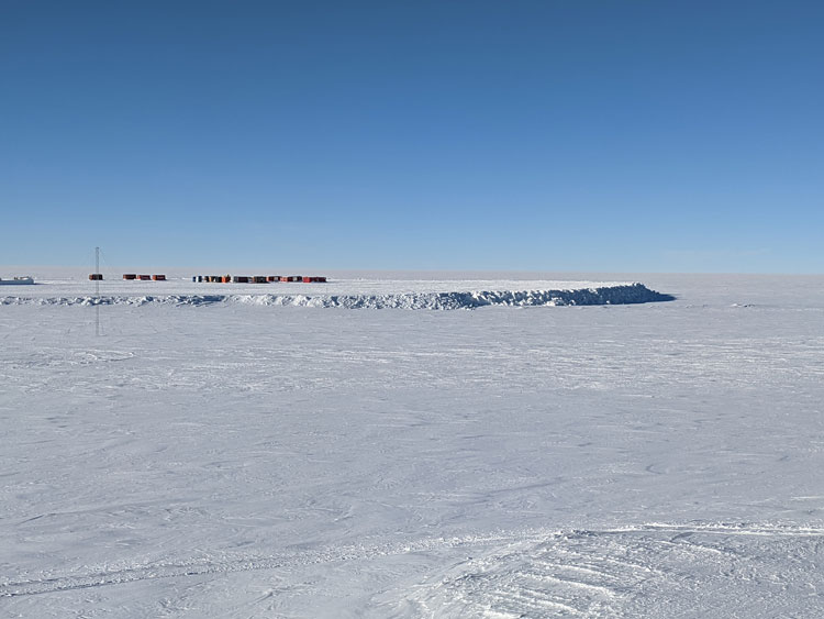 Huge shelf of snow seen in distance at the South Pole.