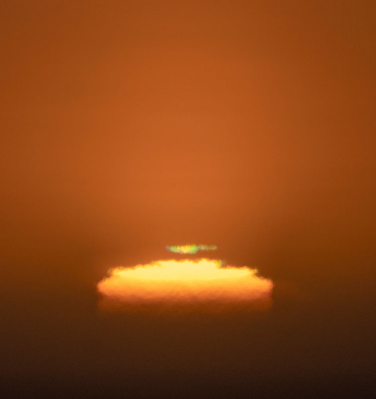 Close-up of setting sun showing the “green flash.”