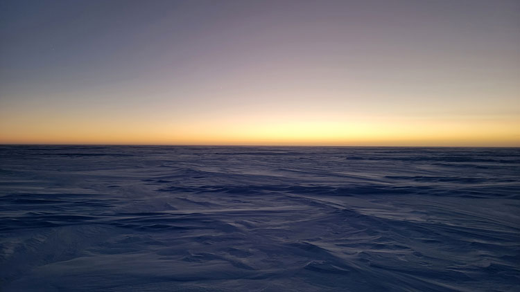 Lingering sunlight along the horizon after sunset at the South Pole.