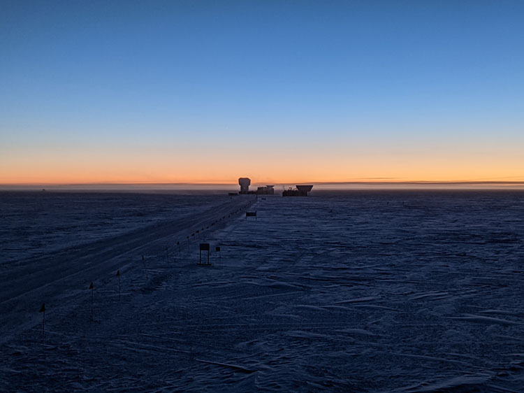 Clear blue sky changing to orange along the horizon at the South Pole sunset.