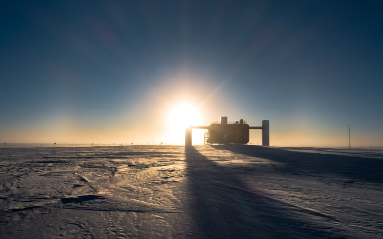 The IceCube Lab and bright sun low in sky