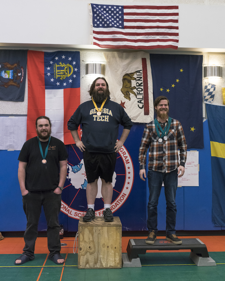 Medal recipients standing on podiums