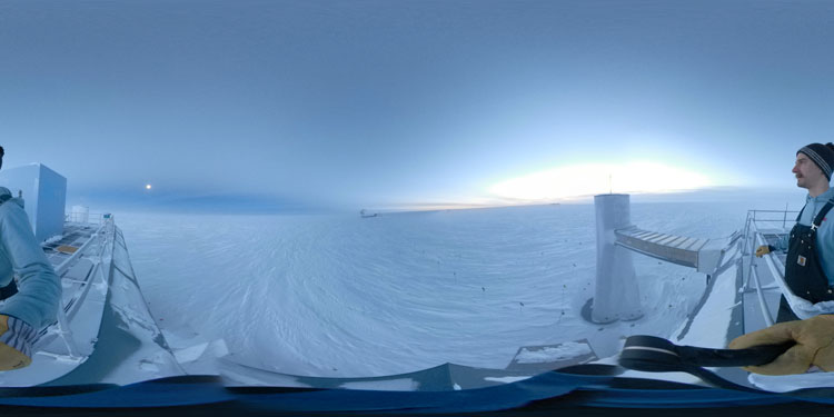 Panorama of South Pole horizon, with moon at left and sun at right, both low in the sky.