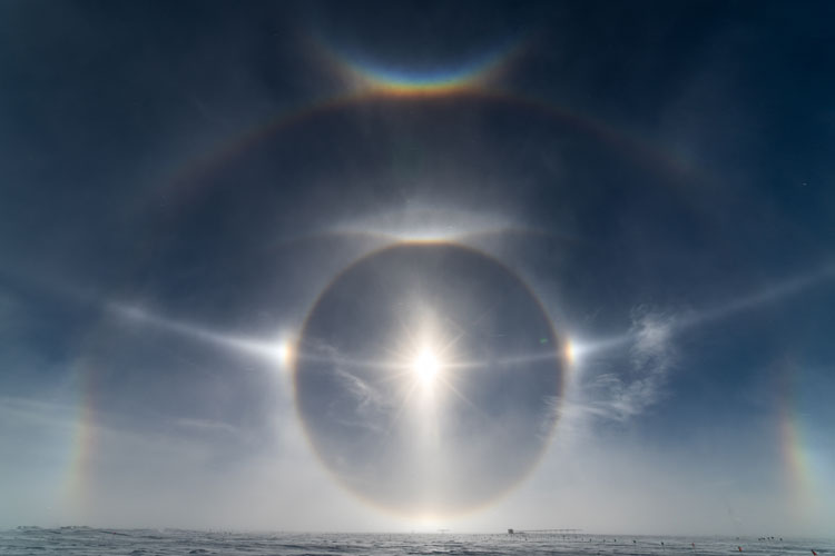 Bright sun with lots of halos and sun dogs.
