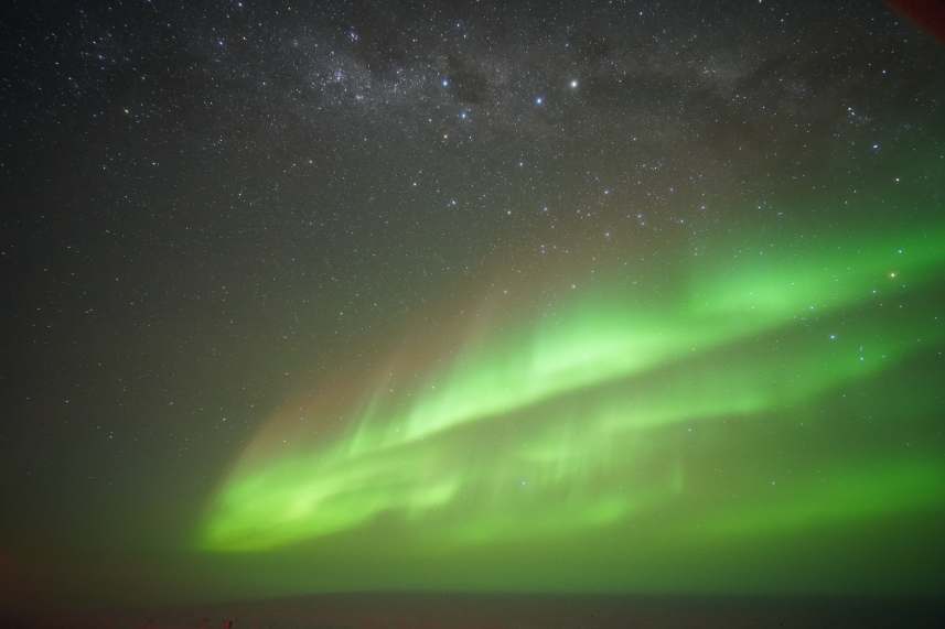 Large green aurora with stars above