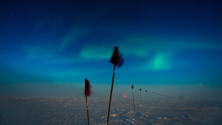 auroras and flag path at South Pole