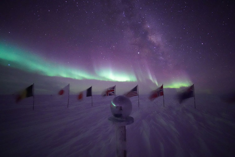 Auroras at ceremonial South Pole marker