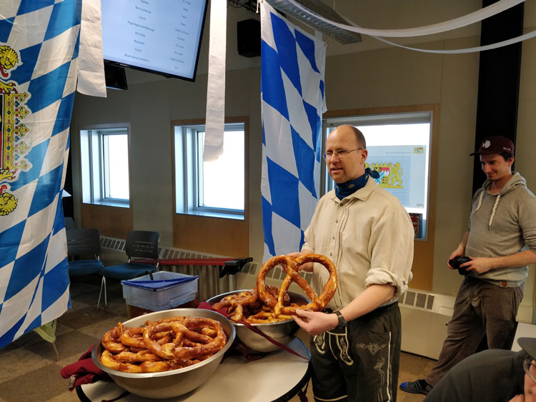 Person holding a large pretzel