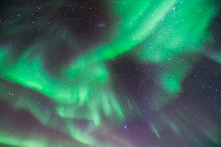 Bright green auroras covering the sky