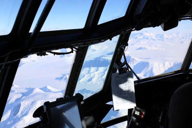 View of Antarctic mountains from plane cockpit