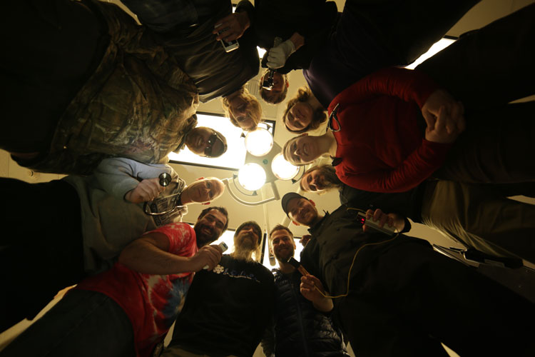 Looking up at circle of emergency response team members