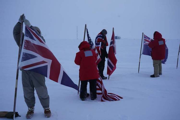 Taking down flags at ceremonial South Pole