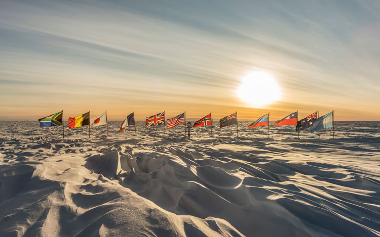 Flags at ceremonial pole in sunlight