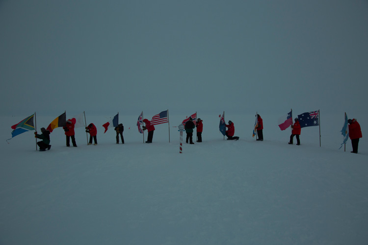 taking down flags from ceremonial South Pole