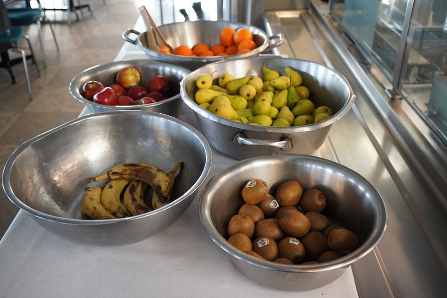 Several bowls full of different fruits