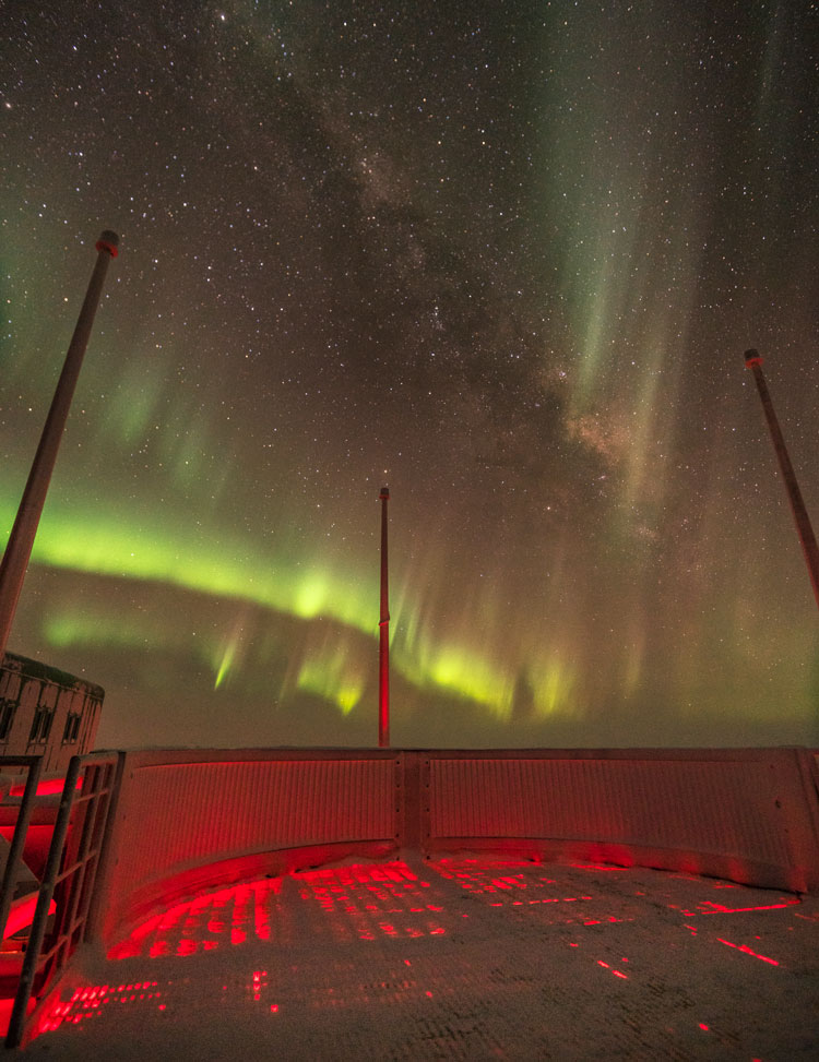Sky full of auroras and stars from observation deck