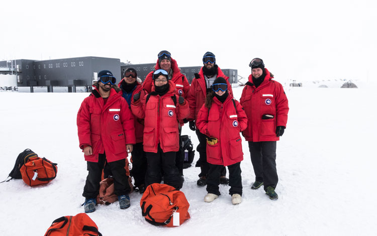 Group posing outside before departure from South Pole