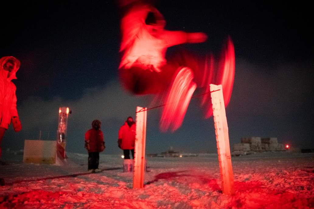 blurry image of high jumping outside in dark