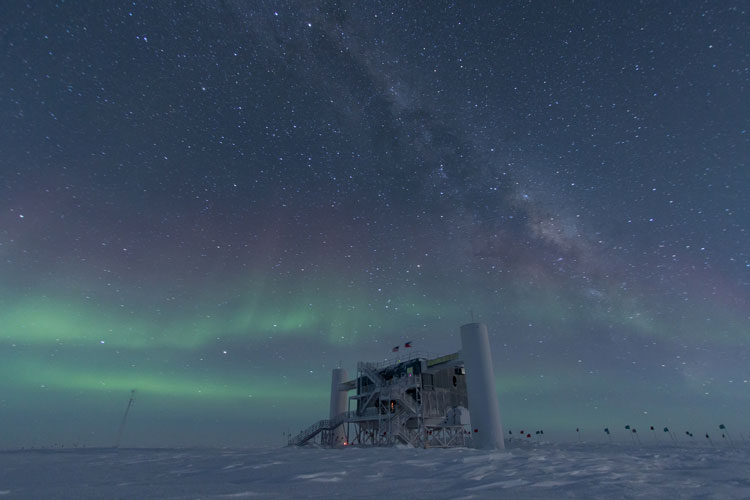 Auroras in the background of the station at the Pole