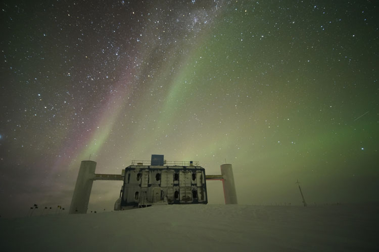 IceCube Lab with starry sky and auroras