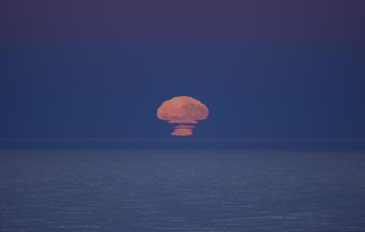 distorted moon rise at the South Pole