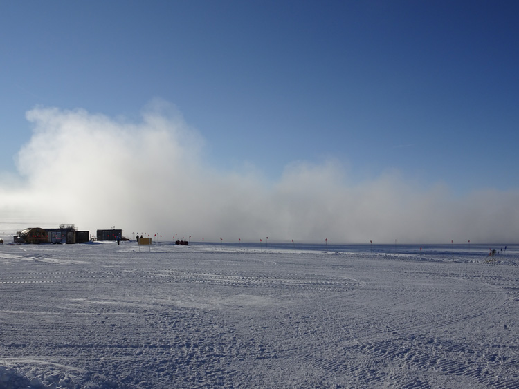 Cloud of snow dust as plane departs South Pole.