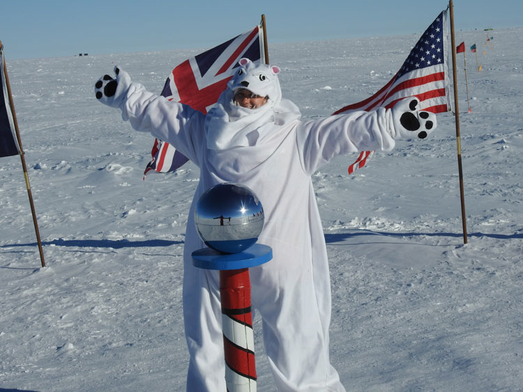 Posing in polar bear costume at the ceremonial South Pole