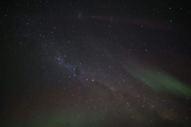 Starry sky with auroras and Milky Way