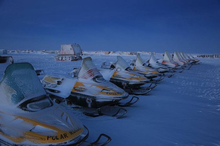 snow mobiles lined up at South Pole